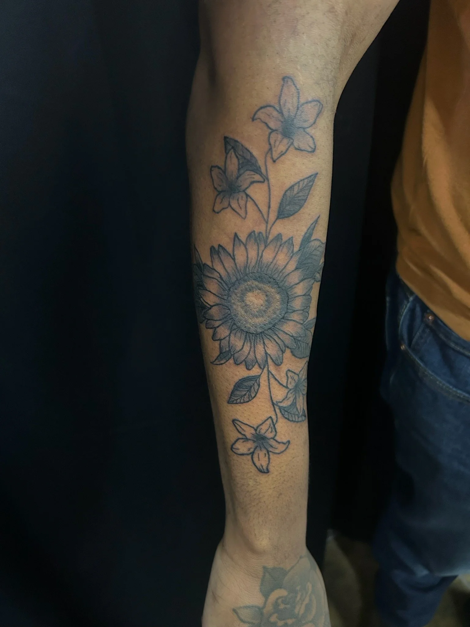 Black and grey lifework flower tattoo