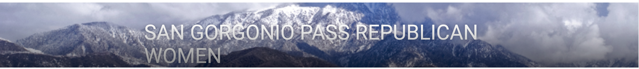 Snow-capped mountains under cloudy sky