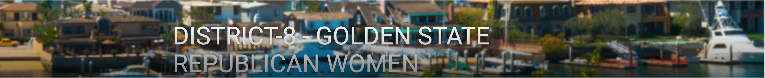 A waterfront neighborhood with houses, boats, and a marina on a sunny day.