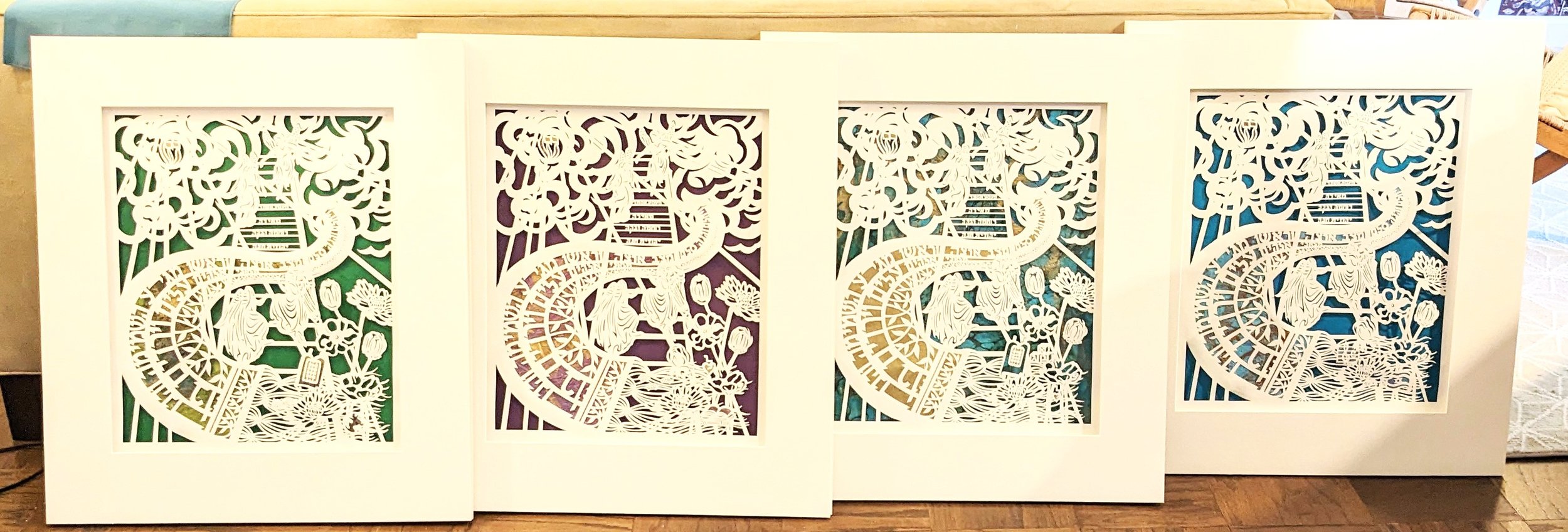 Am Shalom paper cuts matted with backgrounds.jpg