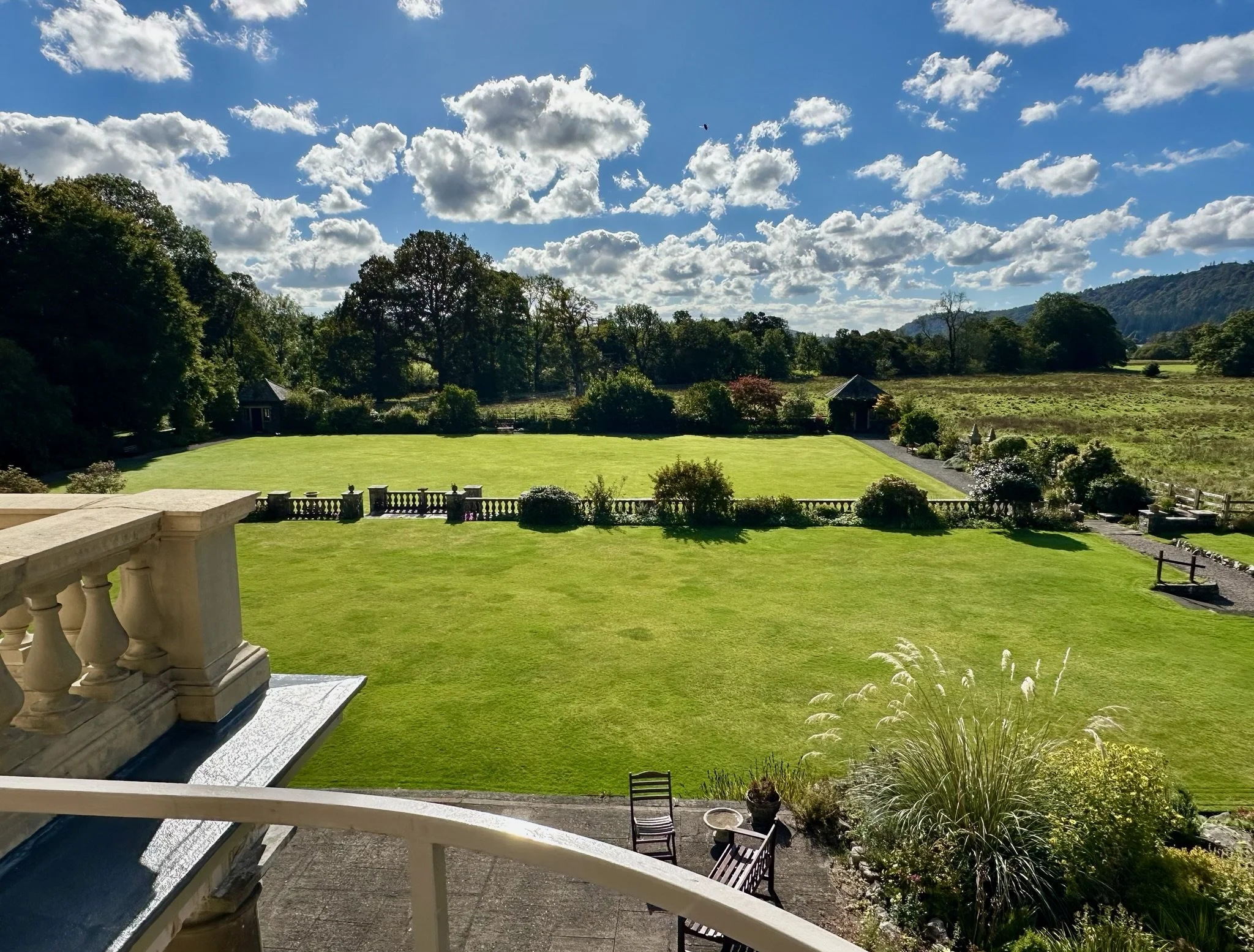 Panoramic view of the lawns, gardens and surrounding countryside at Calgarth Park.