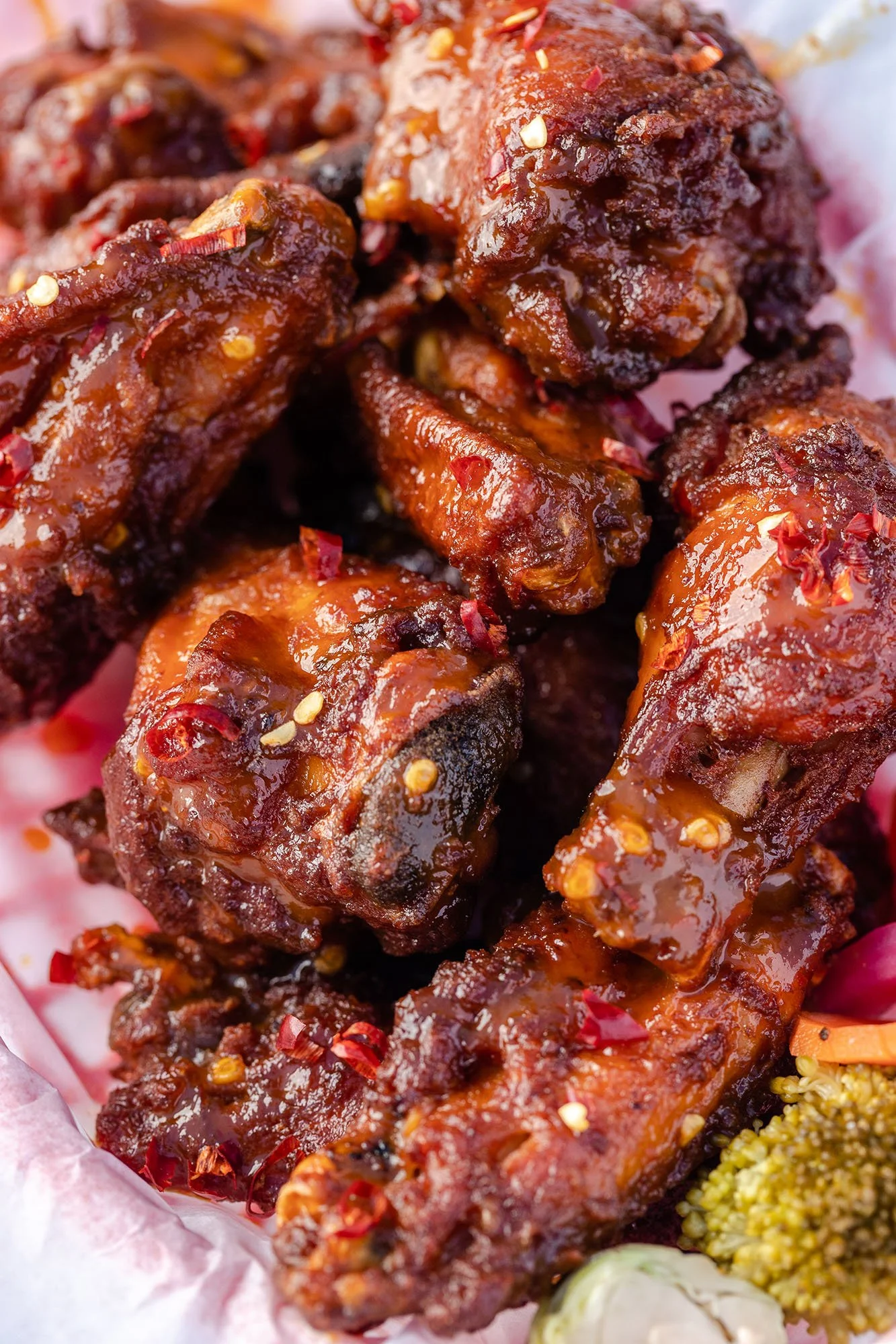 Close-up of glazed spicy chicken wings.