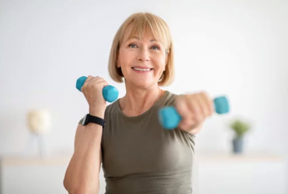 Woman with blue barbells exercising