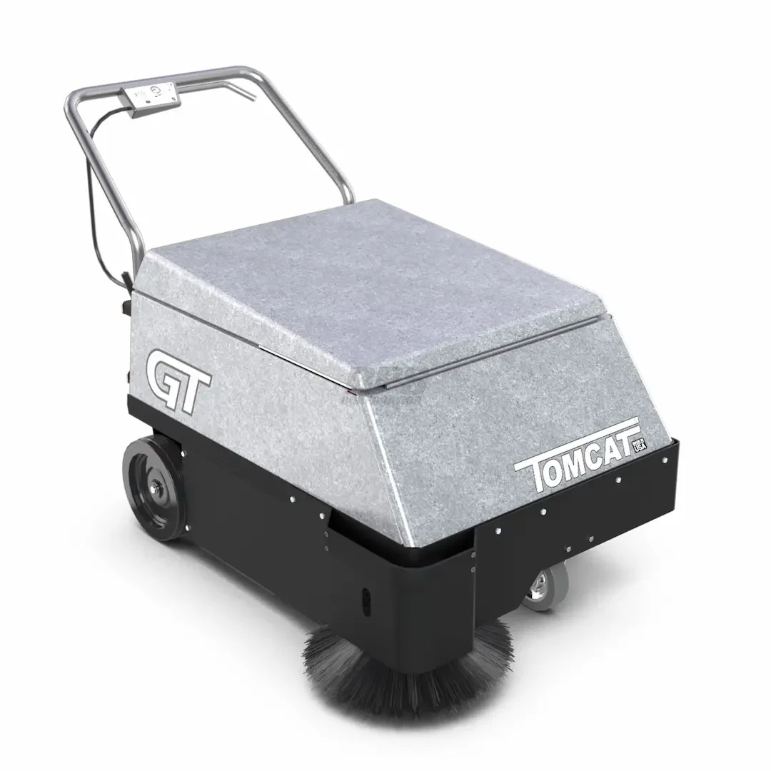 A compact ride-on floor sweeper with a gray top covering the working area, black base, and a spinning brush underneath, labeled 'TOMCAT' and 'GT'.