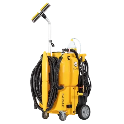 Yellow portable cleaning machine with hoses, wheels, and a spray head.