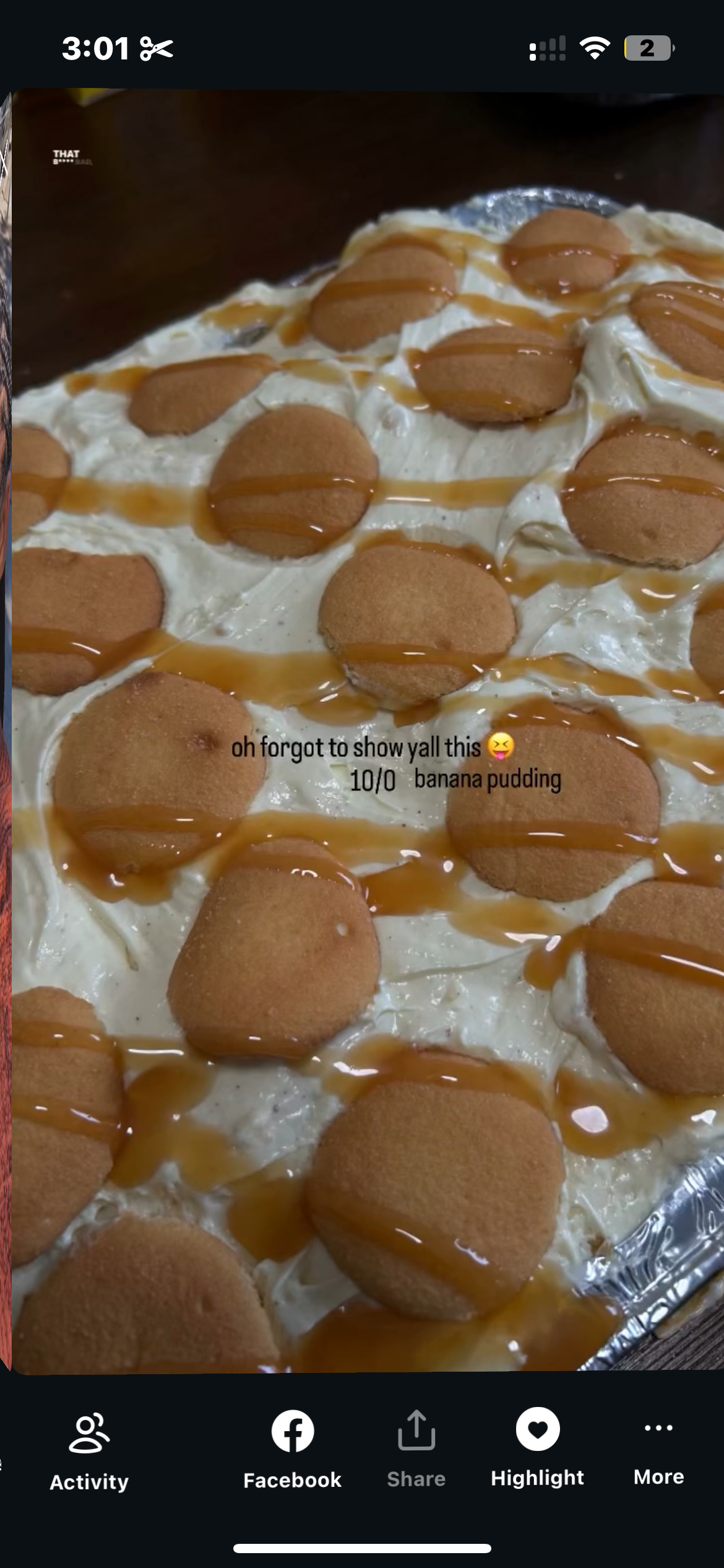 Banana pudding topped with vanilla cookies and drizzled caramel syrup.