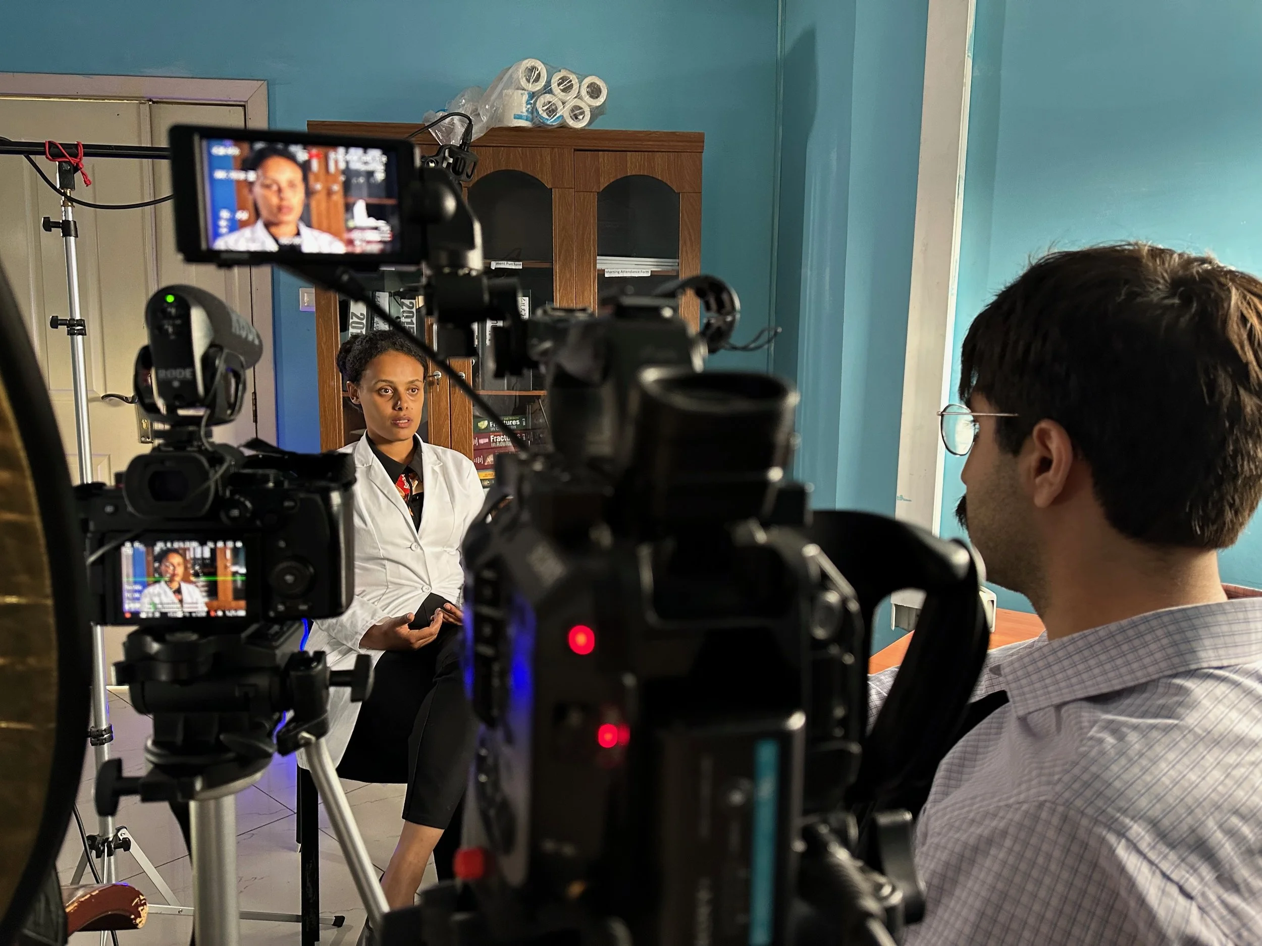 Backer Hamada, the director of Little Camel Films, interviewing an Ethiopian physician.