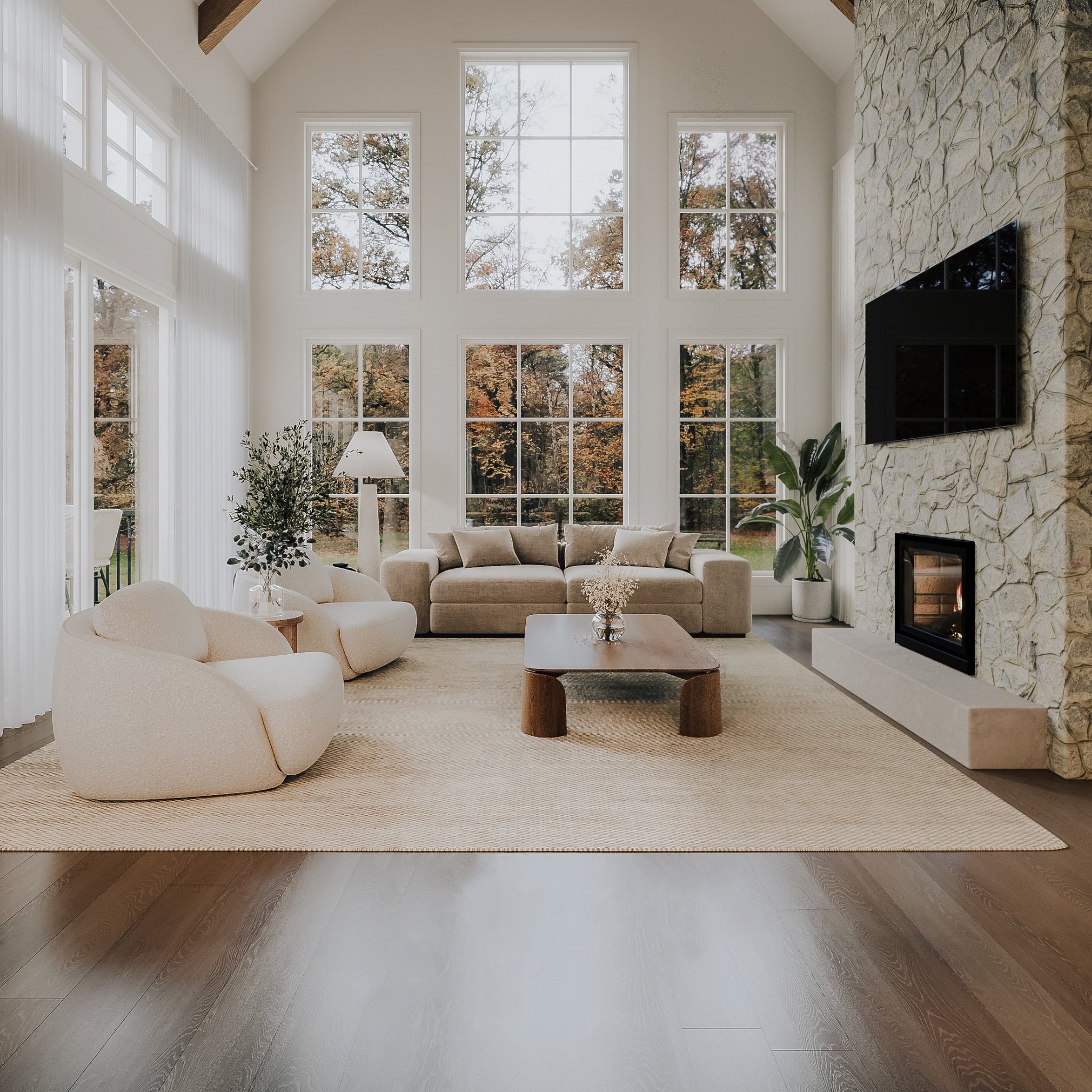 A home with large windows, filled with natural light, featuring a clean and warm design on a spacious wooded lot with lake access in the Lanaudiere region.