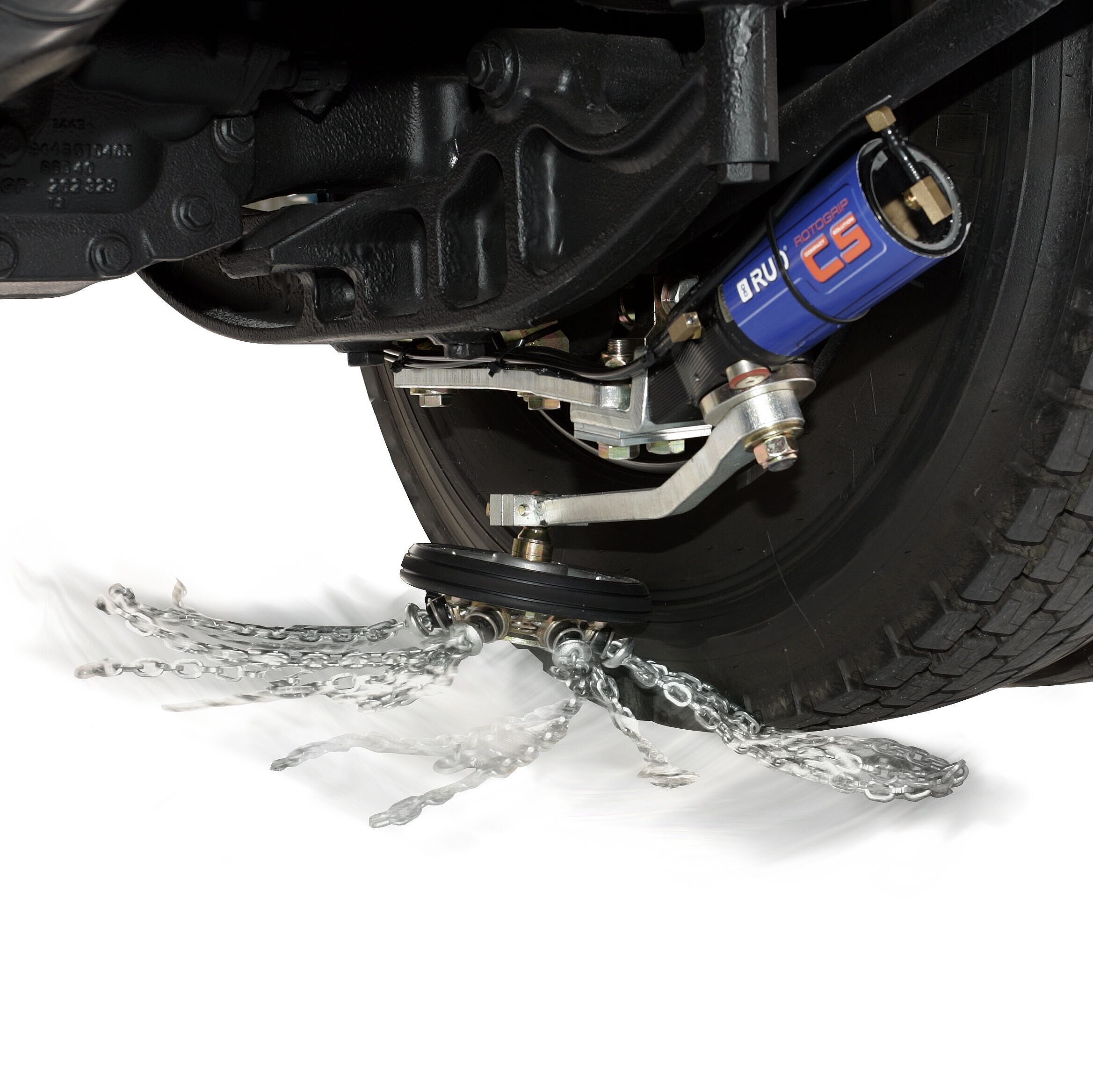 Close-up of a vehicle's undercarriage with a disc brake and a water spray mechanism for cleaning or cooling the wheel.