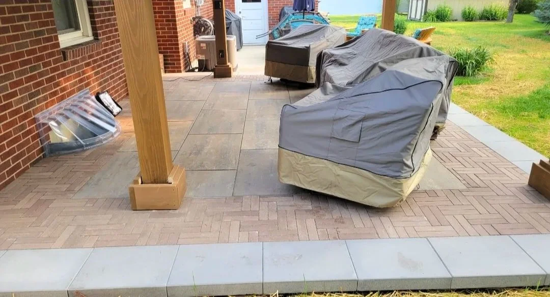 Paver patio with handcrafted overhead wooden structure