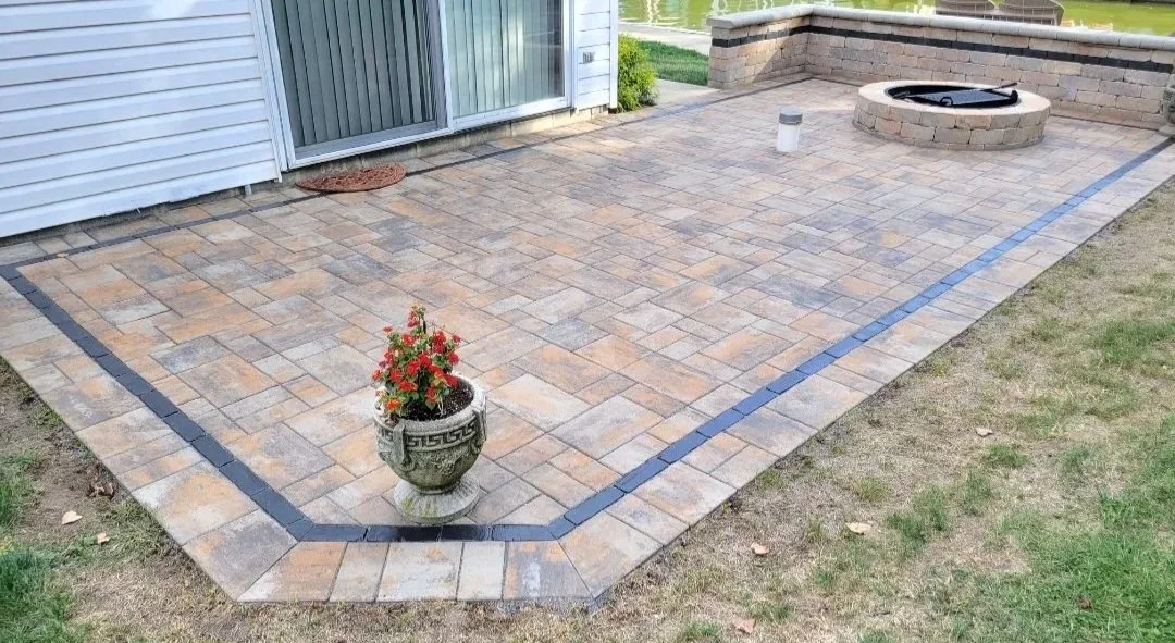 Paver patio with fire pit and decorative seat wall