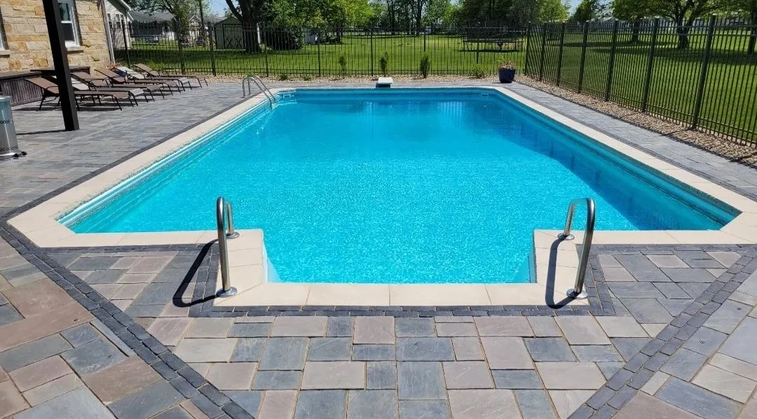 Paver patio around a pool