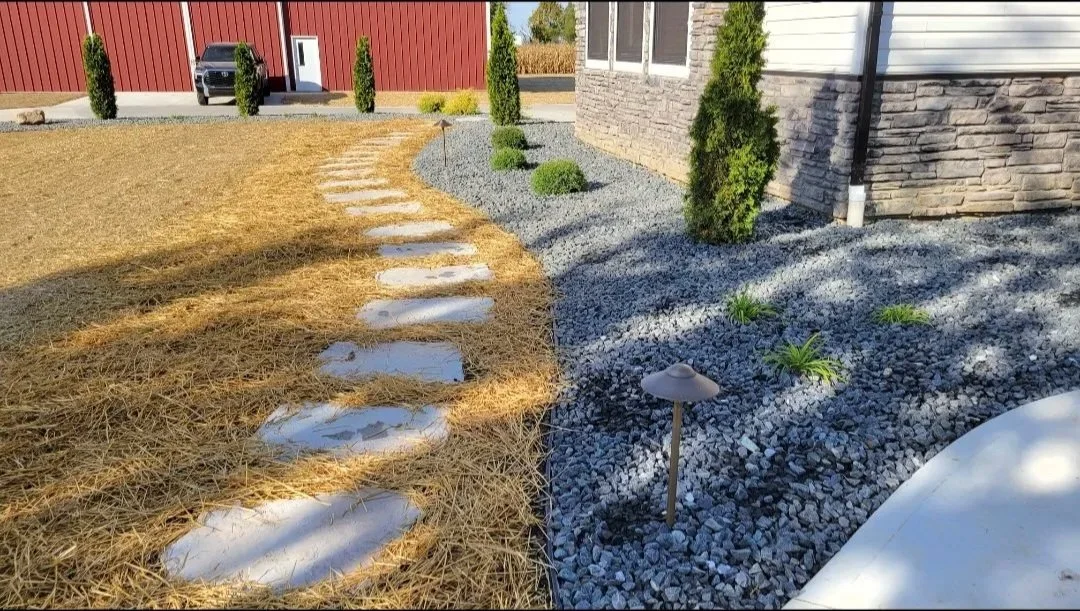 Stepping stone pathway and a landscape design with decorative stone