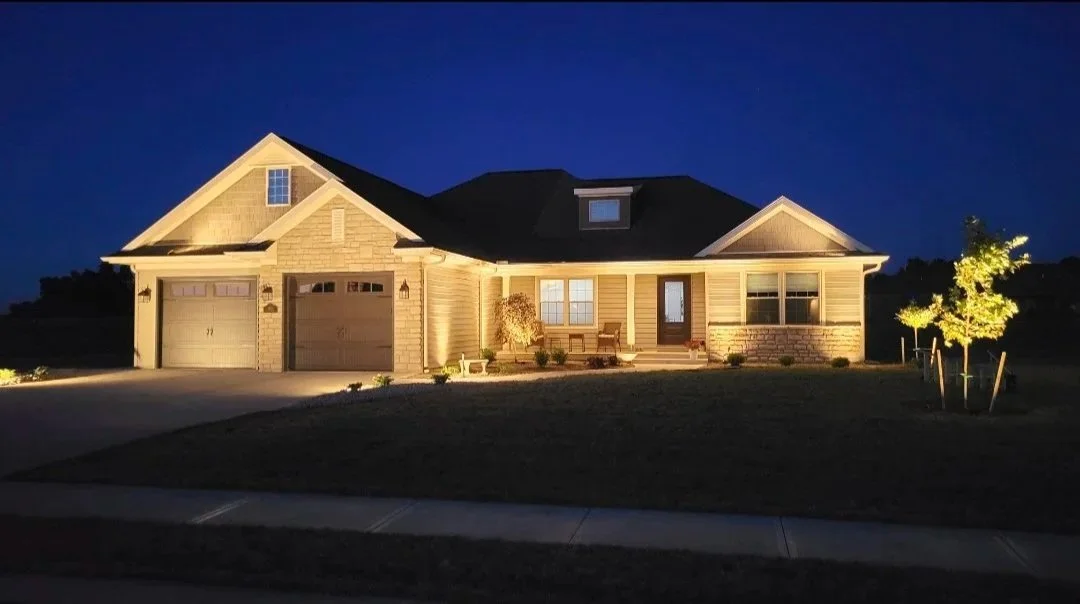 Landscape lighting on a single story home.
