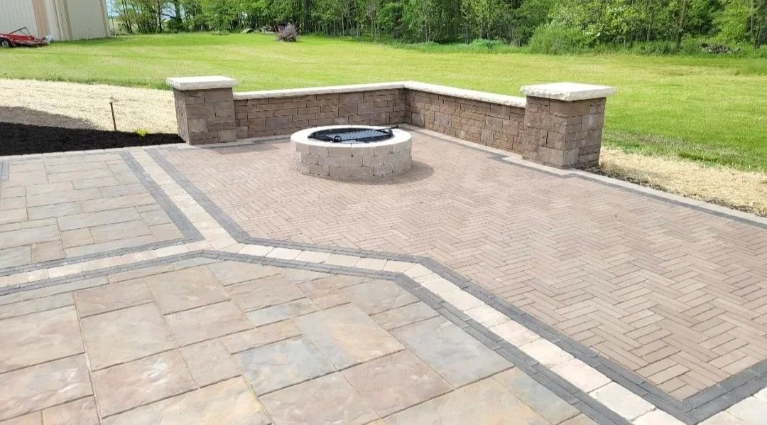 Paver patio with fire pit and decorative seat wall