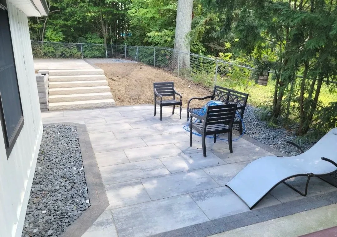 Paver patio with a staircase