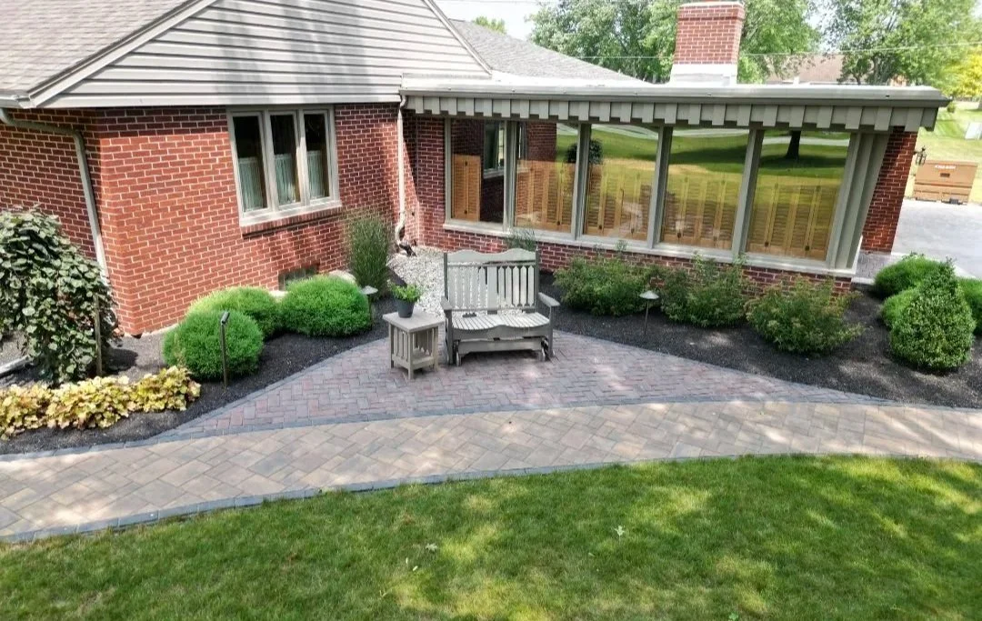 Paver walkway with a landscape design and rocker