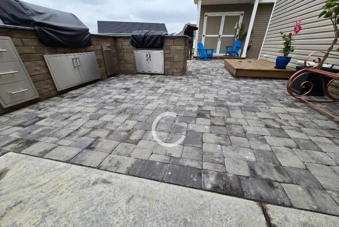 Outdoor living space with outdoor grill island and custom shed and man cave