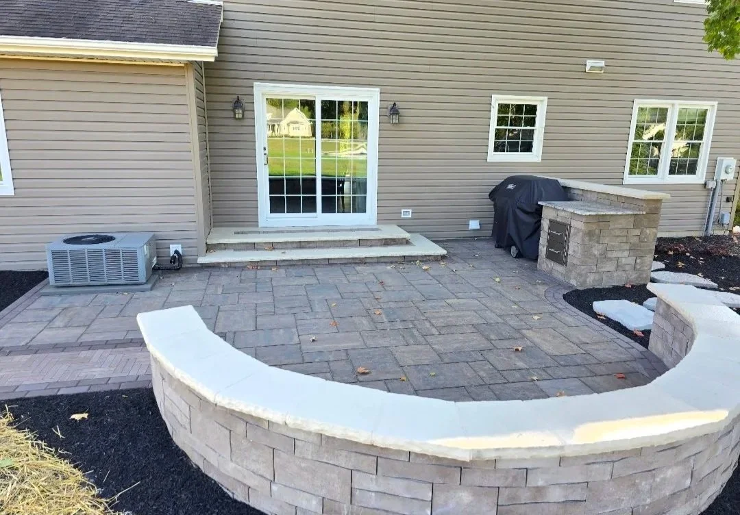 outdoor paver patio using unilock mattoni, holland premier and beacon hill flagstone pavers with decorative seat wall and grill island in wapakoneta ohio