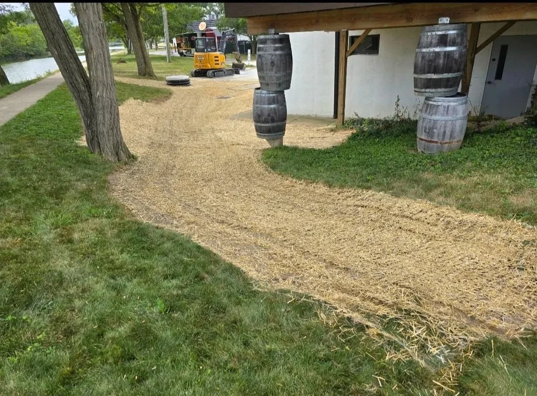 grading and seeding around a sump pump pit