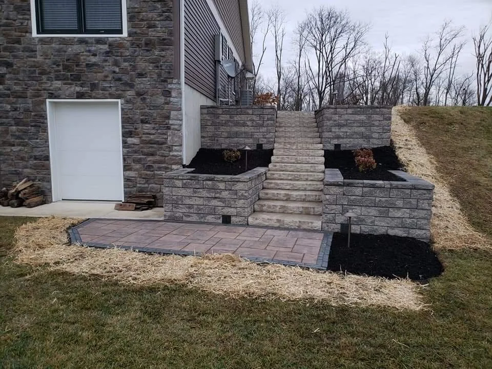 Retaining walls with staircase and paver landing