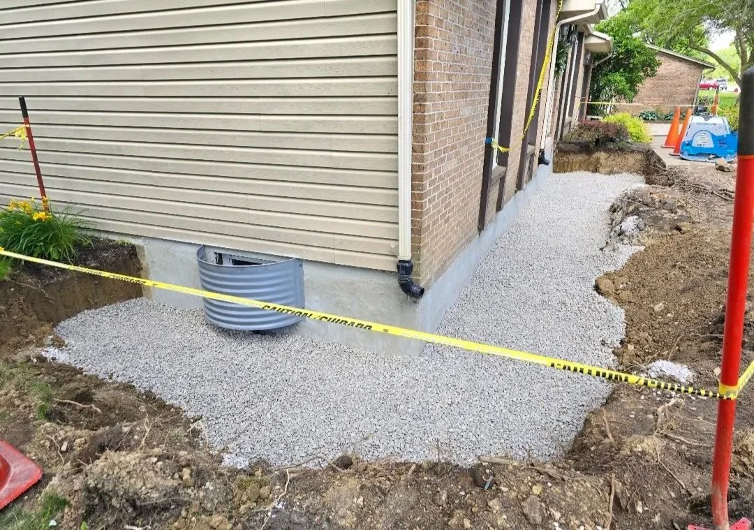 backfilling around the foundation of a home with 57 stone