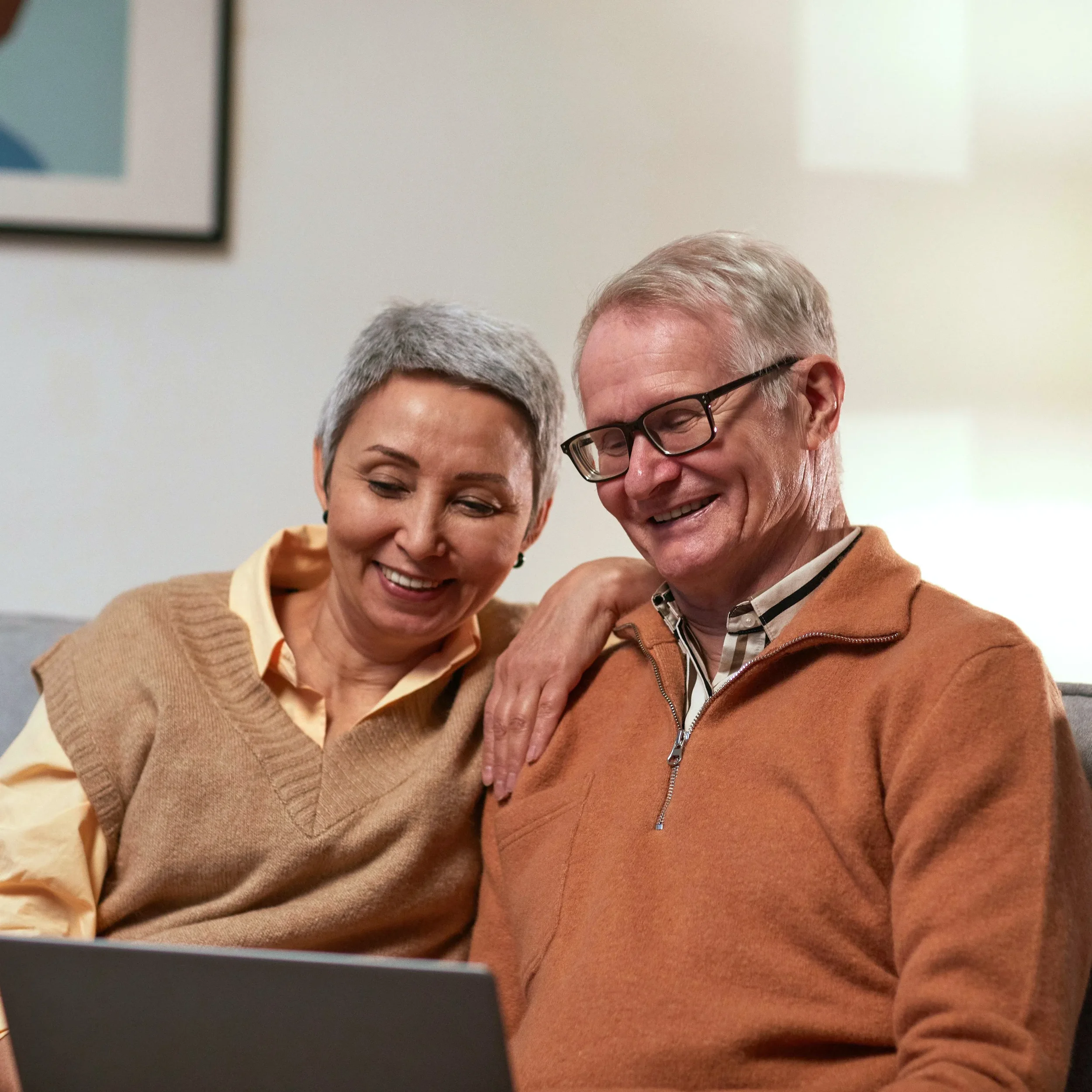 couple smiling together on teletherapy session
