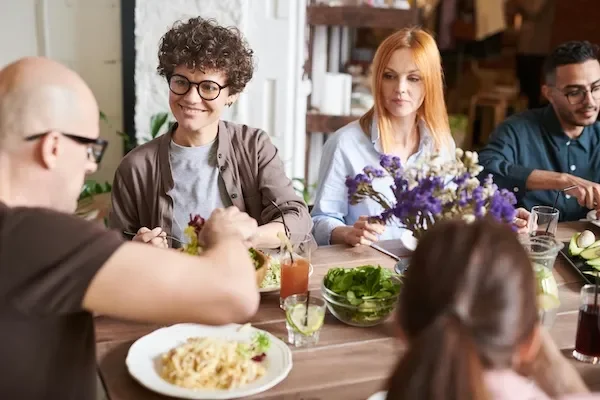 group of adults at dinner party