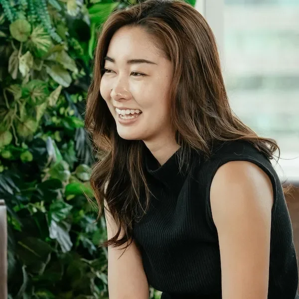 smartly dressed woman smiling