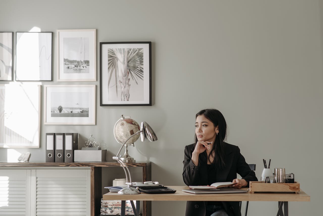 woman-in-black-blazer-sitting-on-a-chair