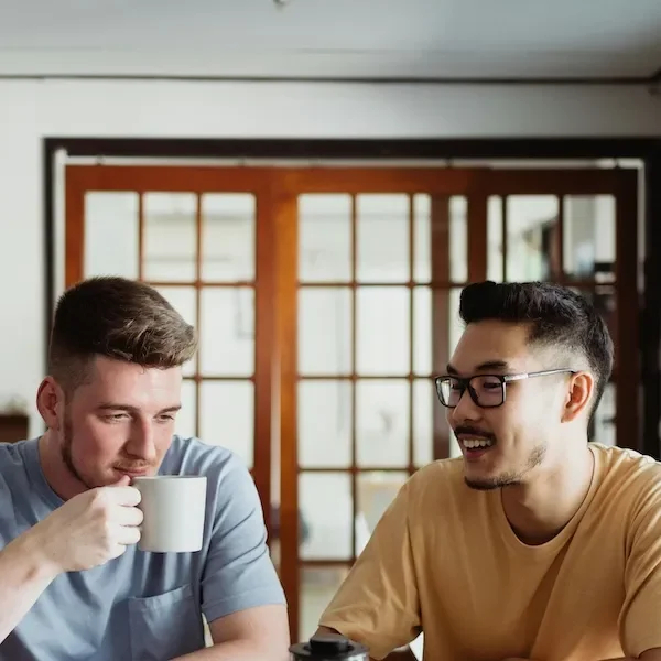 two friends having coffee together