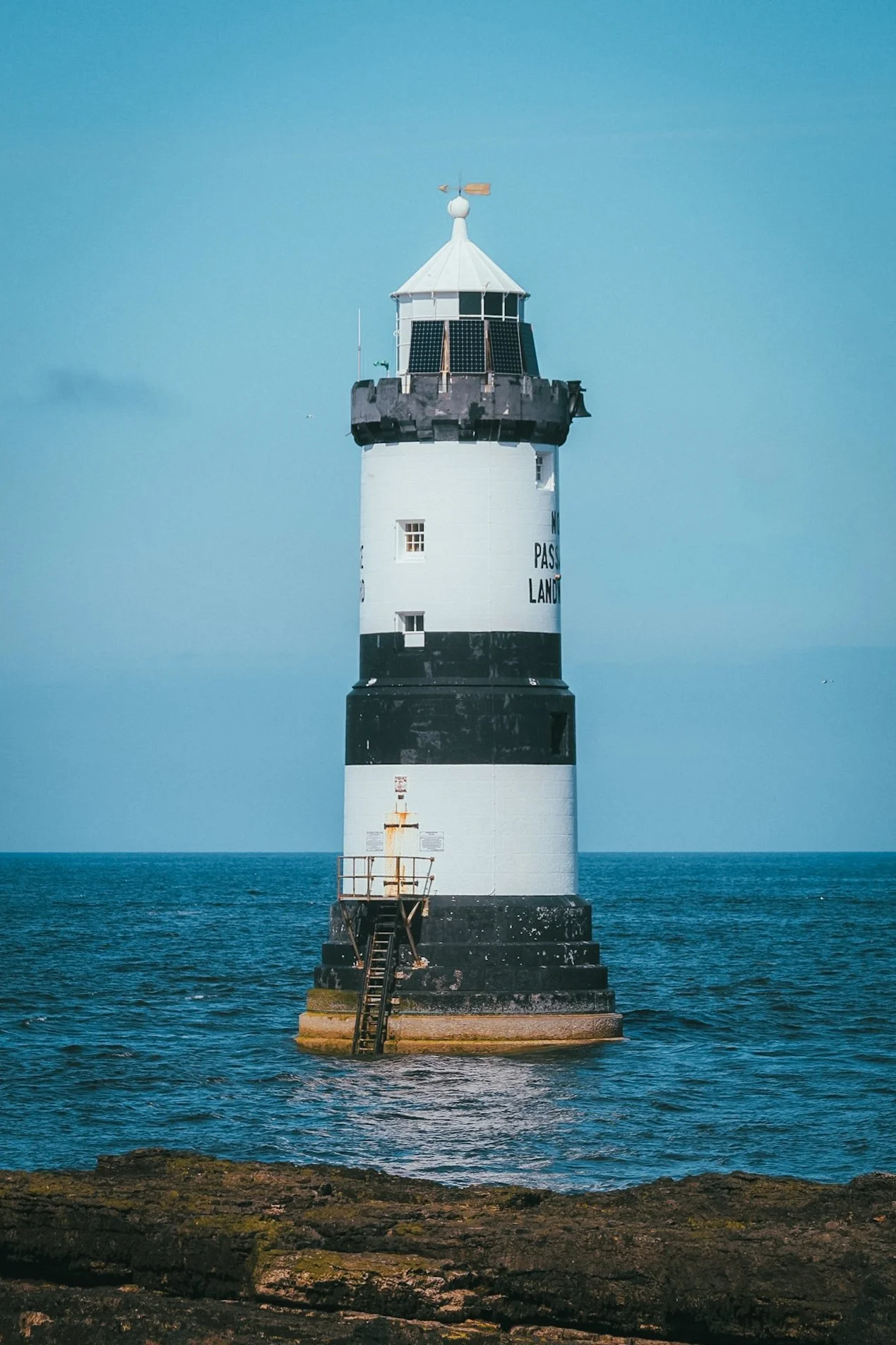 Penmon Lighthouse standing in the sea off Anglesey