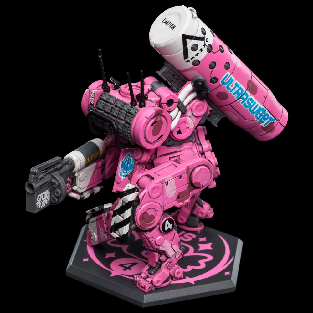 A pink and black detailed mecha figurine with a large missile launcher labeled "Ultrasuper" mounted on its shoulder, standing on a black base with pink symbols, set against a black background.