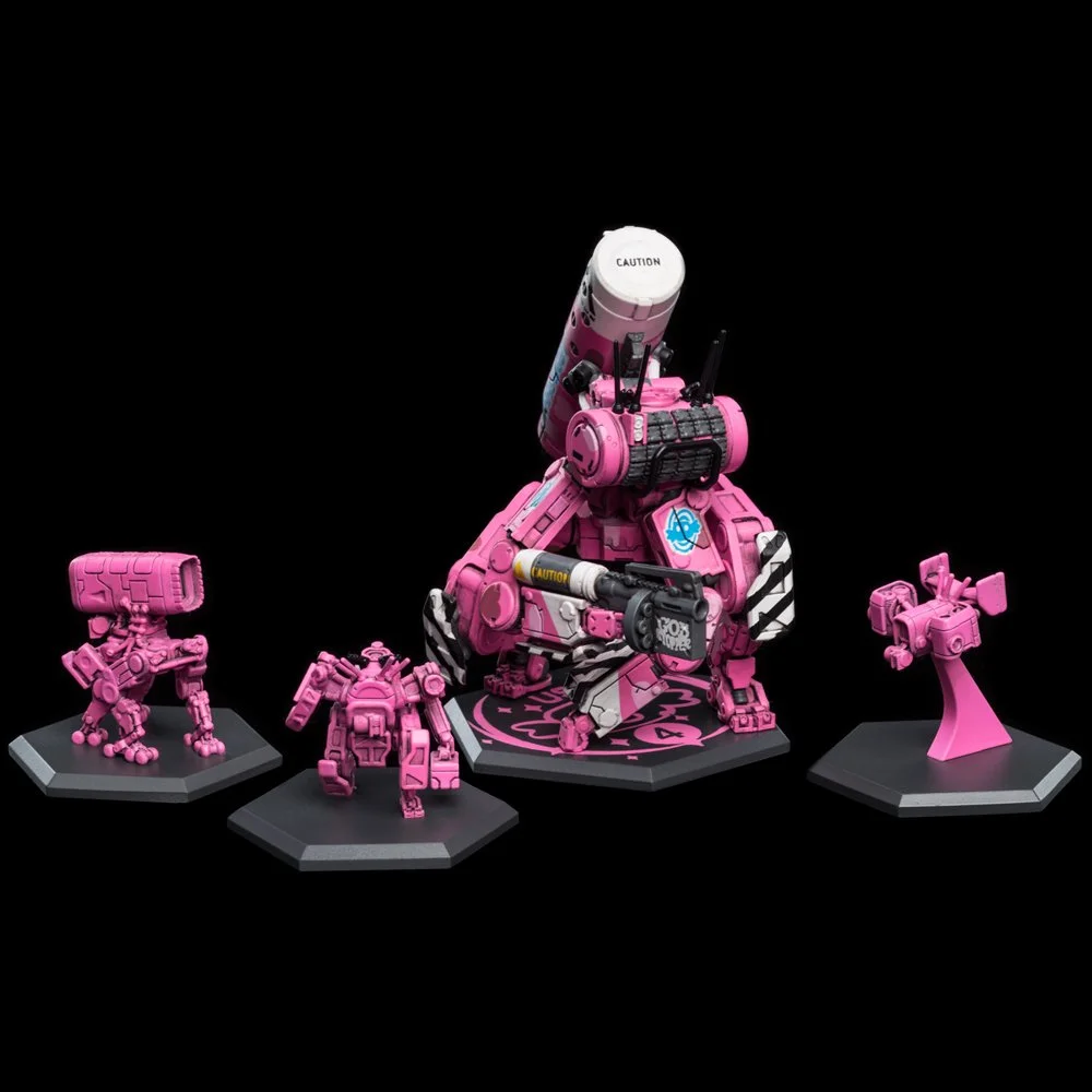 Collection of four pink robot figures with various designs, set against a black background.