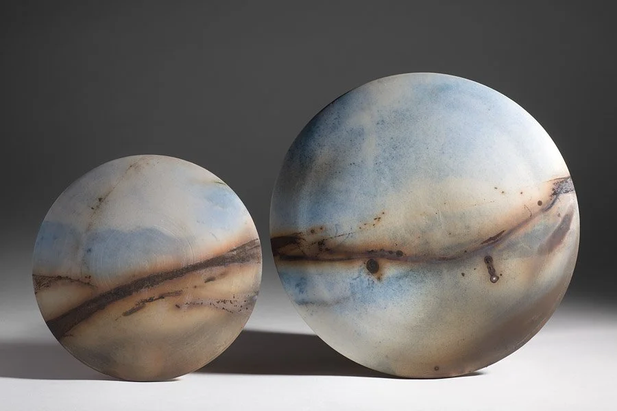 ´Sunset Skies´ 2012 Set of 2 Wall Discs
White Stoneware Clay, Thrown & Saggar Fired with West Cork sawdust, seaweeds, recycled wires & oxides 
(H) x (L) x (W)
22.5 cm x 22.5 cm x 2.5 cm, 17 cm x 17 cm x 2.5 cm