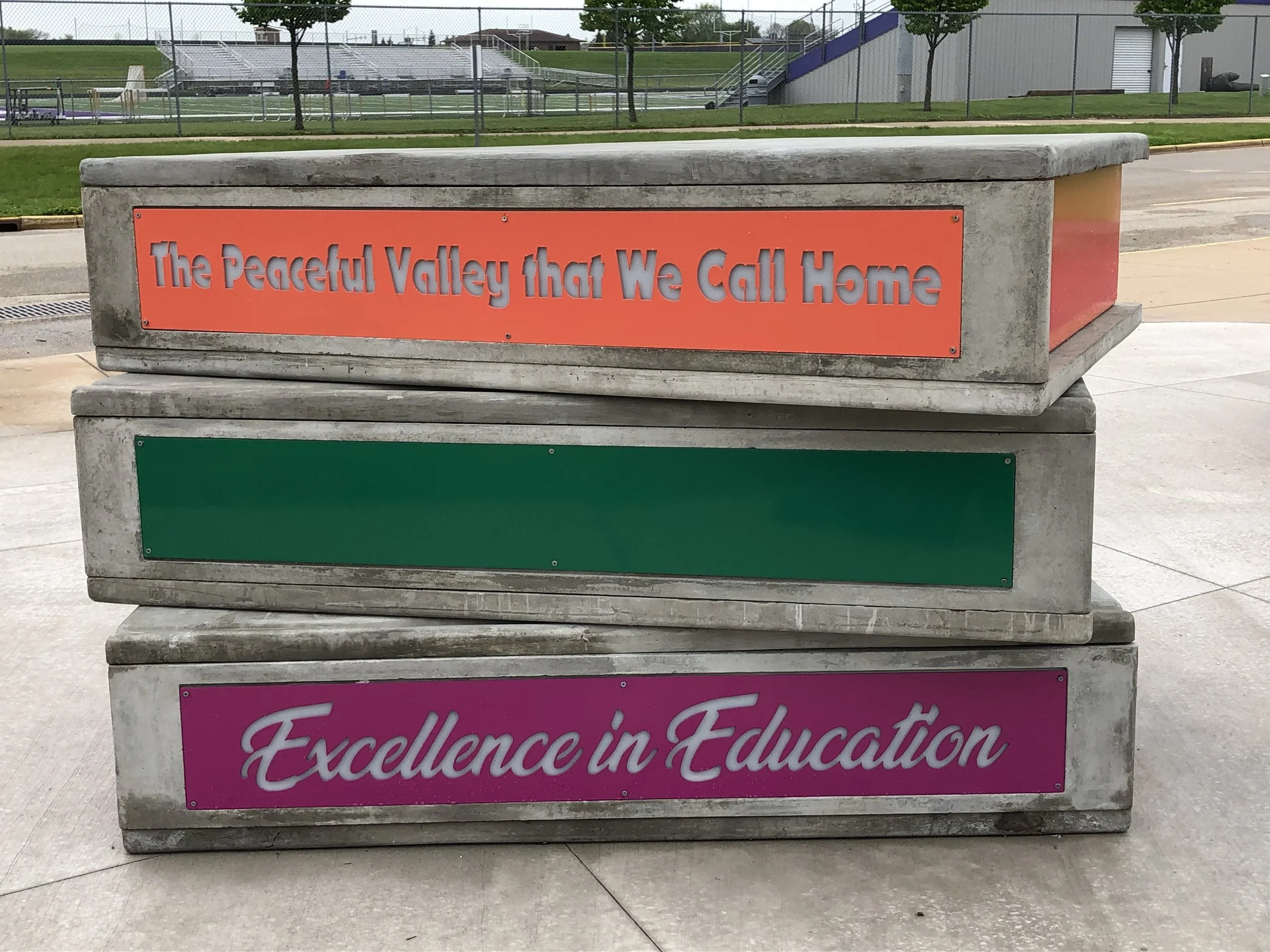 Public Art celebrating 'Excellence in Education' of the Waunakee Community School District. A colorful interactive sculpture by world renowned public artist Michael Kalish.