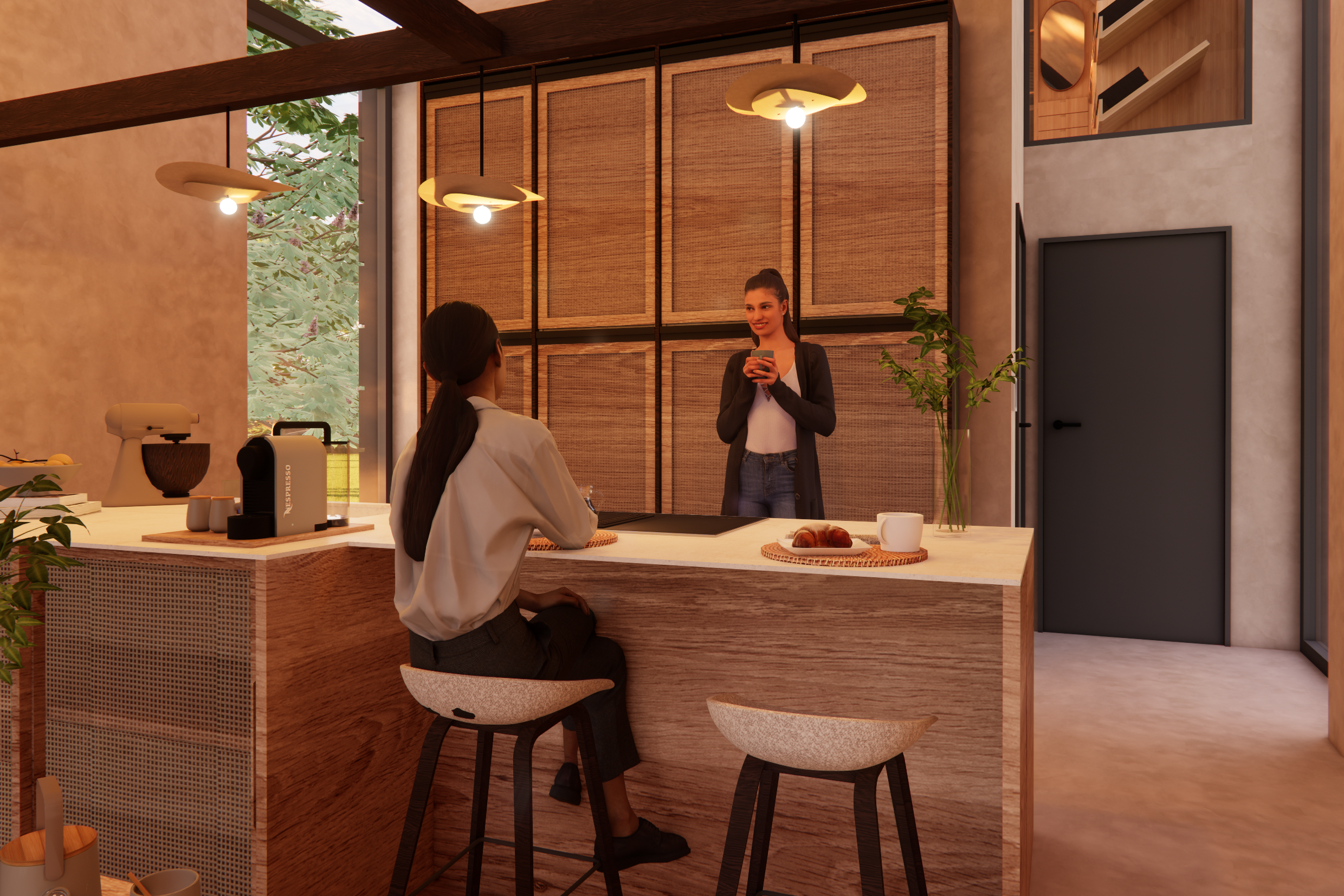 Two women in a modern kitchen, one sitting on a barstool and the other standing behind the counter, holding a mug.