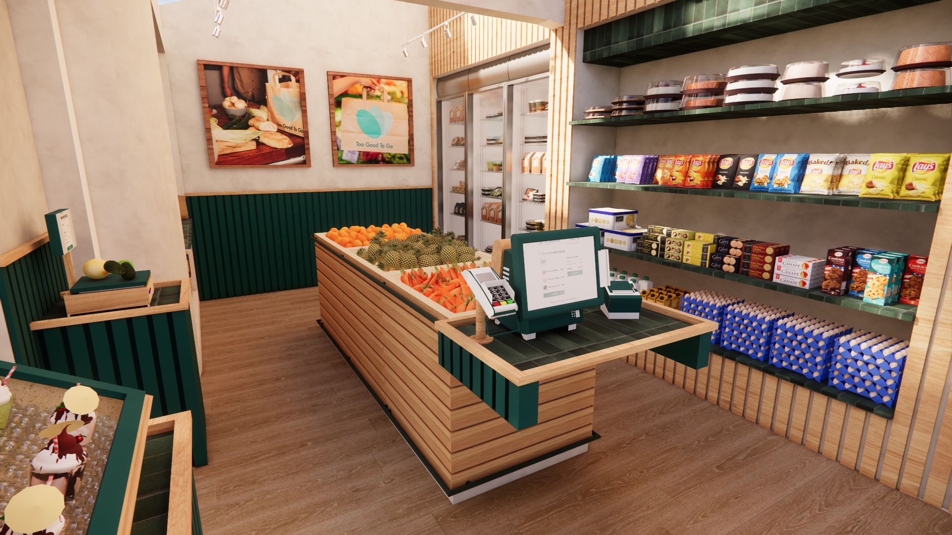Interior of a small grocery store with a checkout counter, fresh fruits like oranges, strawberries, and cactus fruit, shelves stocked with snacks, chips, and cookies, and framed posters on the wall.