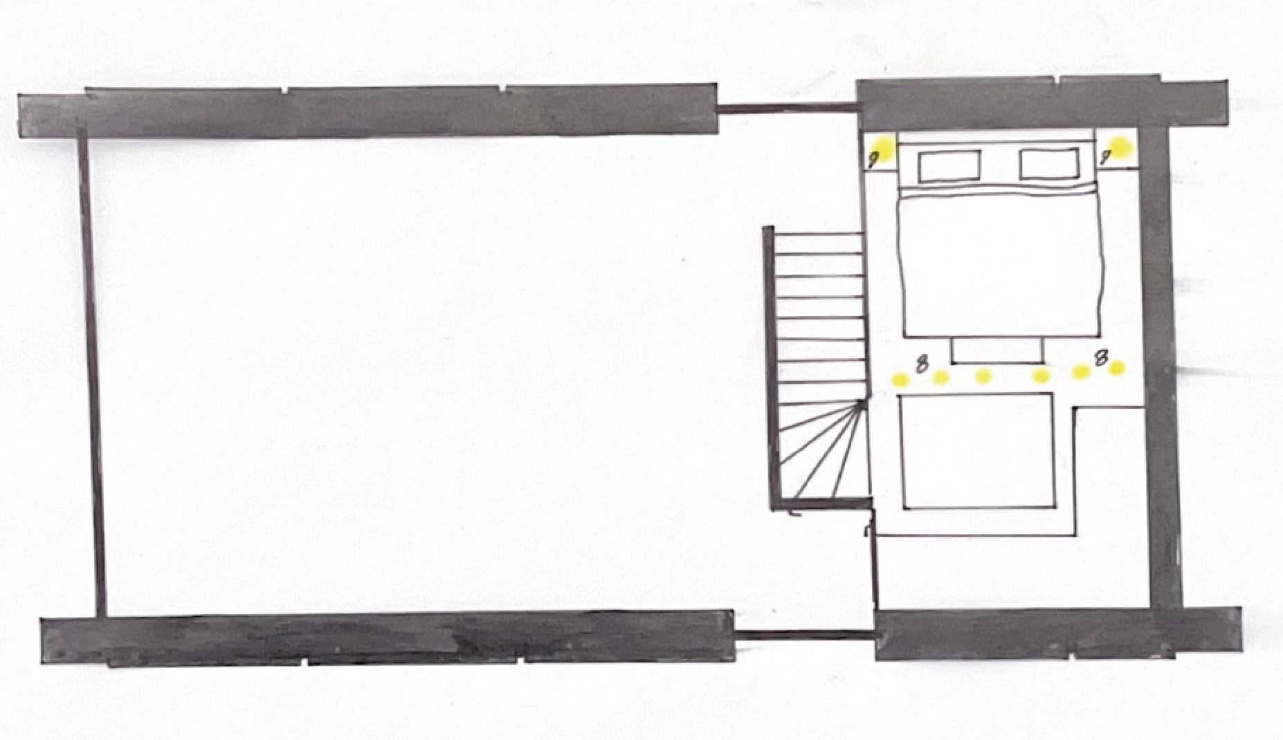 Hand-drawn floor plan of a room with a staircase, bed, and lighting fixtures, using black and yellow ink.