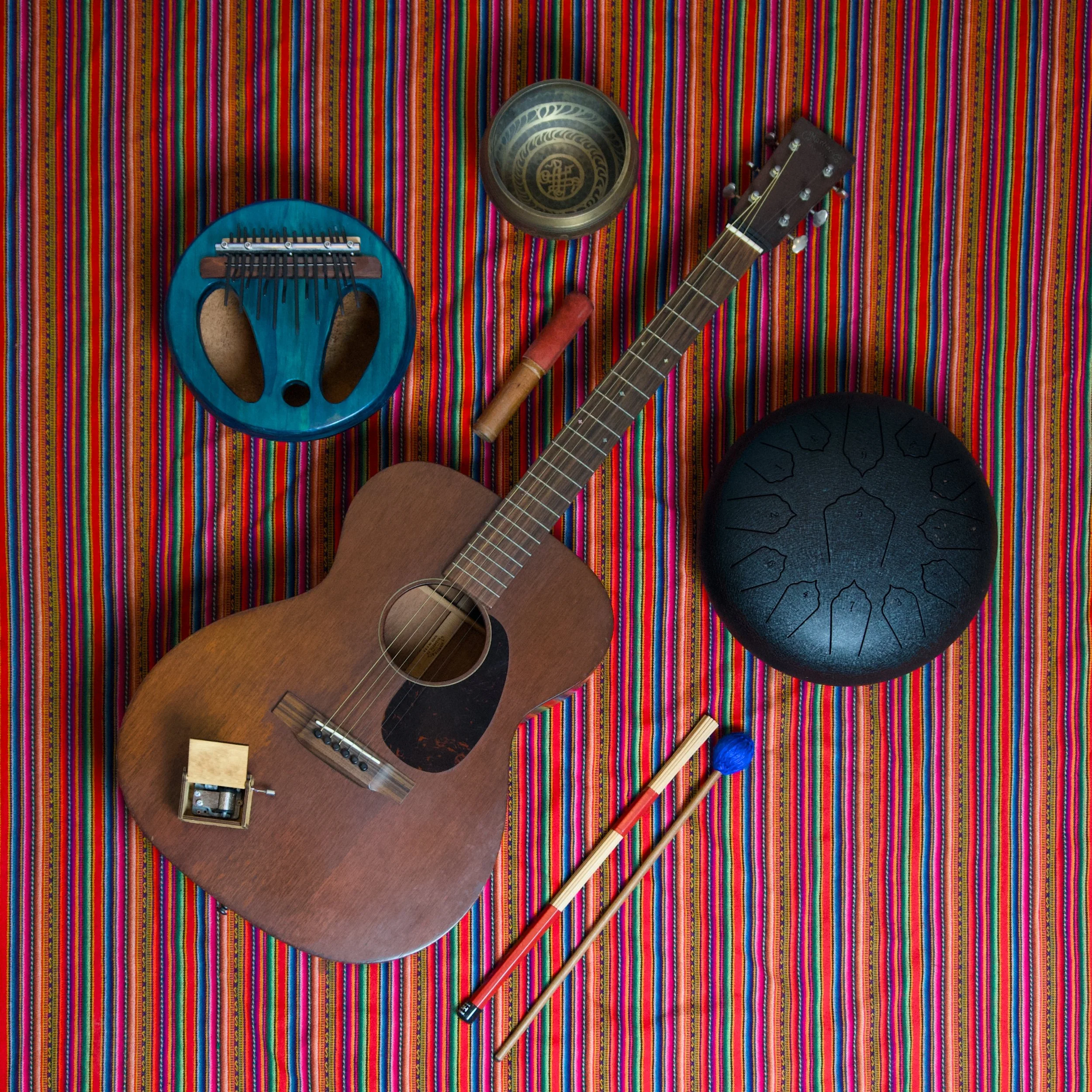 All instruments in "Puntos", a steel string guitar layed with stick mallets, a tongue drum with soft, hard, hotrod, and hand options, a pumpkin kalimba with pluck, shake, felt, and hard pick options, a music box, and a singing bowl.