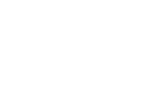 Close-up of large white quotation marks on a black background.