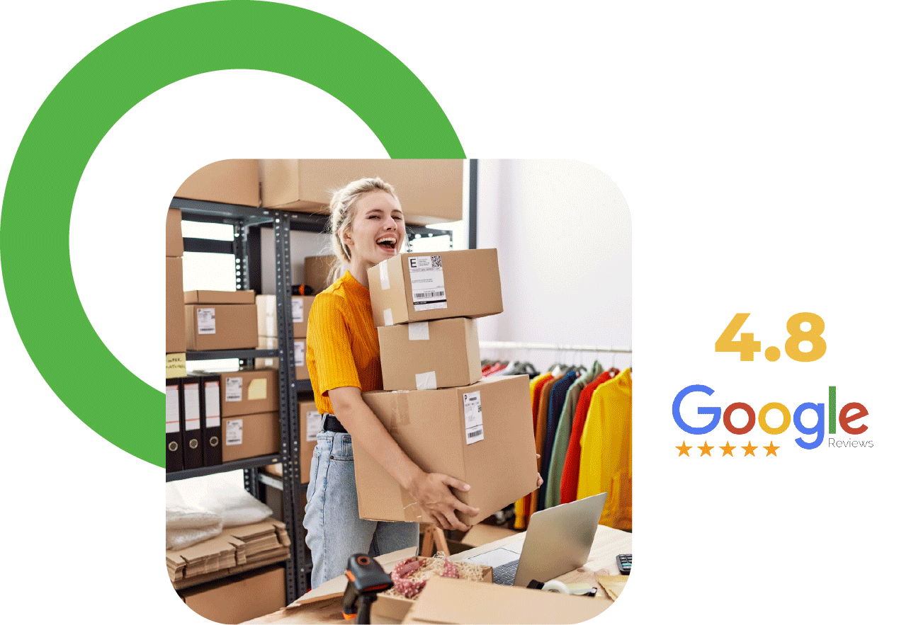 A woman in a yellow shirt holding stacked cardboard boxes in a warehouse, smiling. Shelf with boxes, a clothing rack with colorful clothes, a laptop, and packing materials are visible. Overlayed text shows a 4.8-star review rating from Google.
