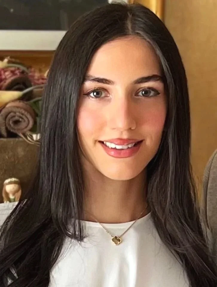Bright beautiful girl, with long dark hair and friendly smil