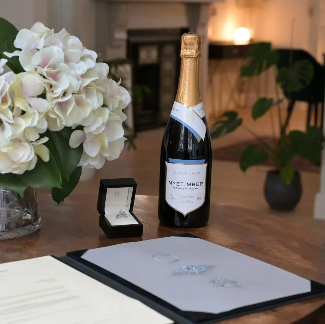 Jewellery presentation folder with original painting and bottle of champagne
