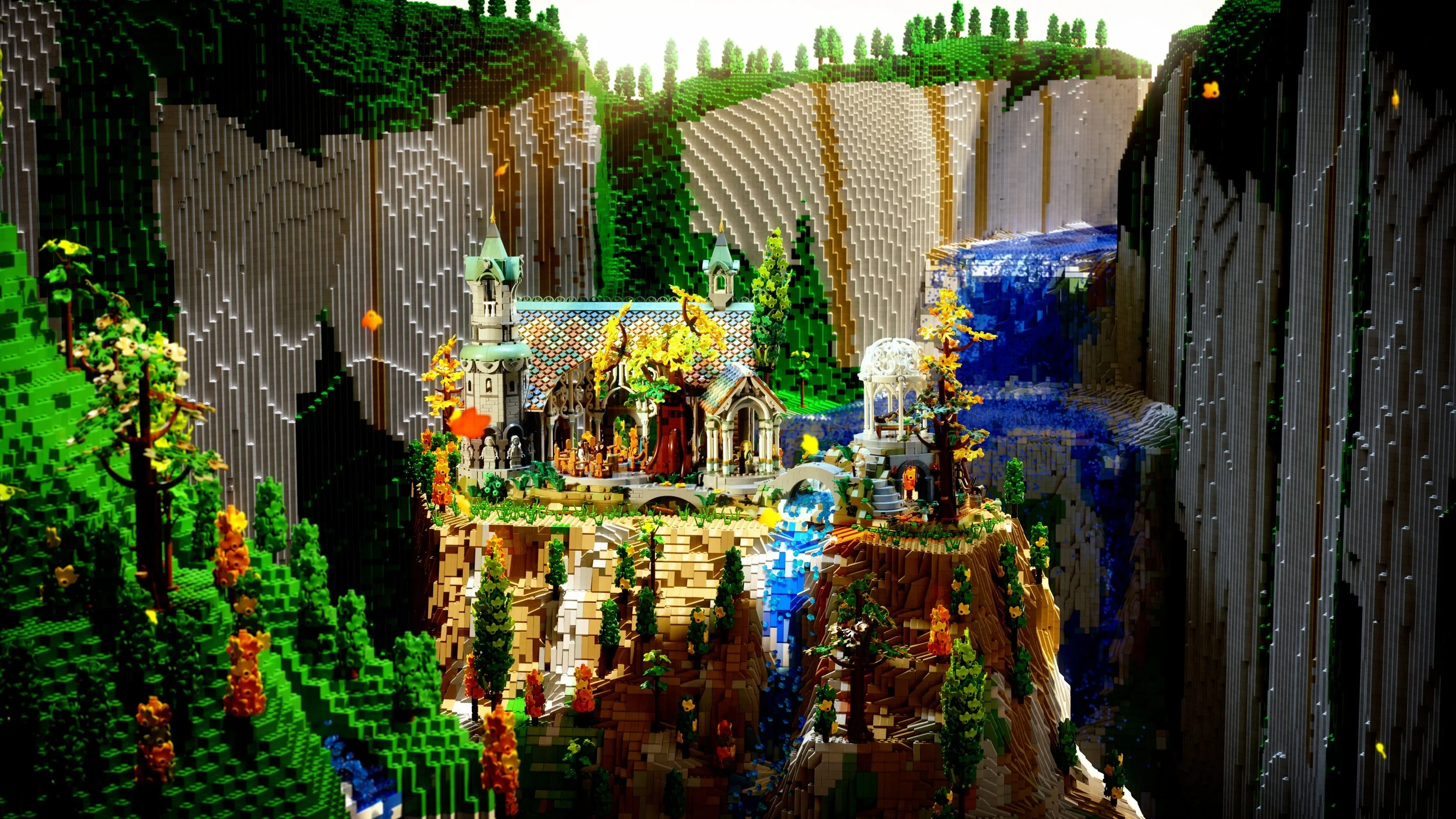 LEGO Lord of the Rings Rivendell landscape with castle, trees, water, cliffs, and mountains.