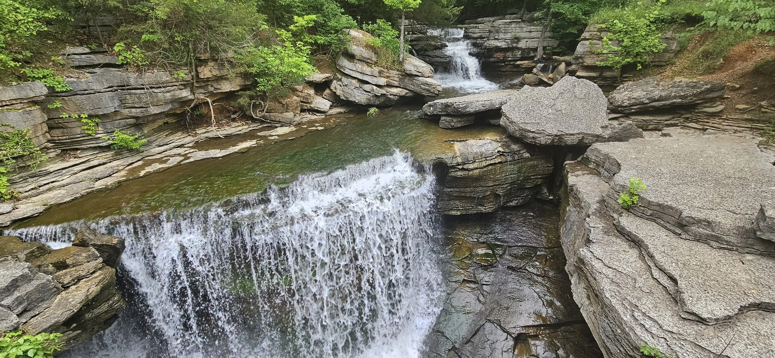 A beautiful view of the rocky Pinion Creek waterfall along the Back 40 trail near Lake Anne dam in Bella Vista.