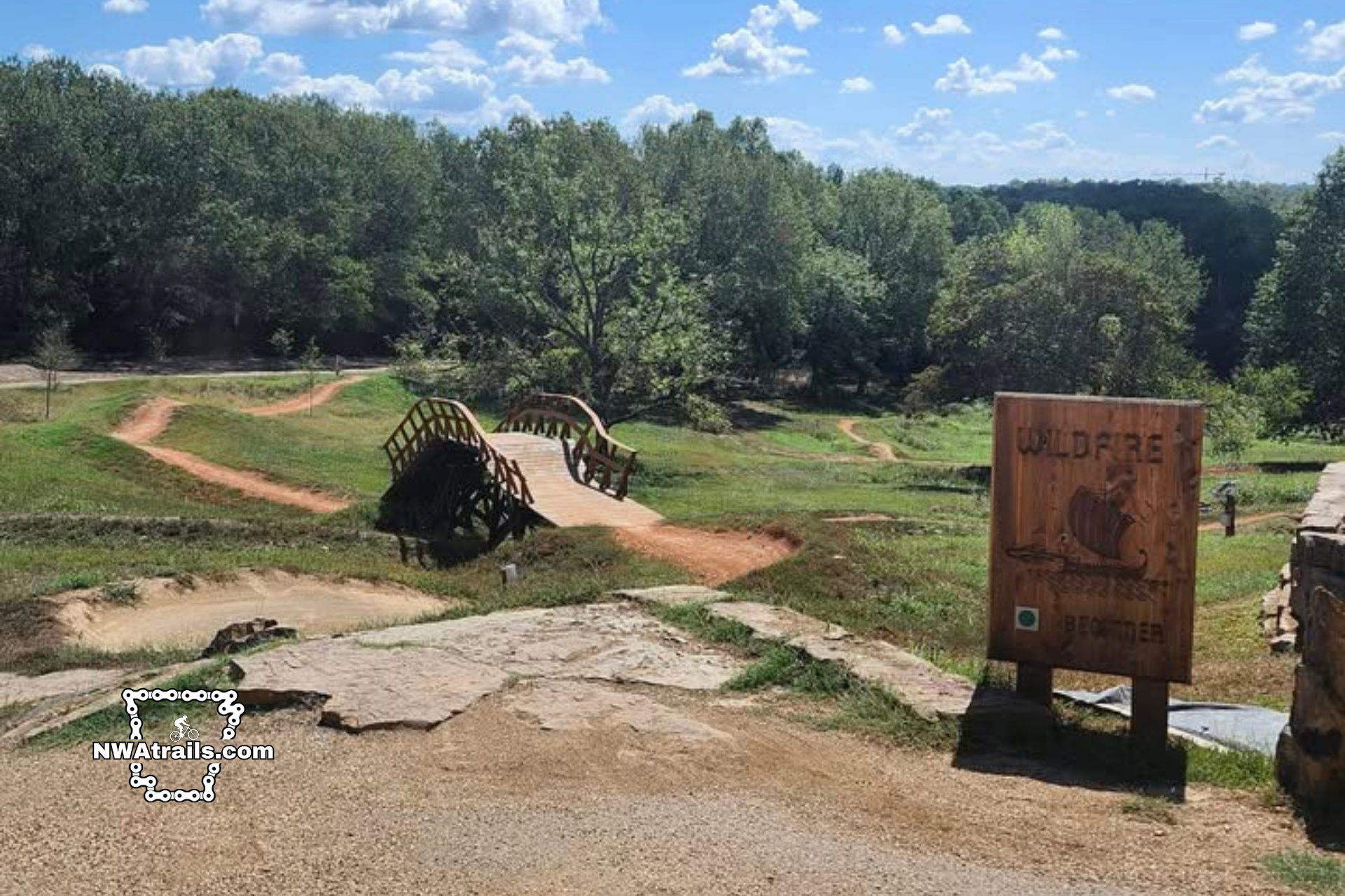 An overlook at the Castle in Slaughter Pen. The view is of the Wildfire trail in the summertime complete with the large wooden trail sign.