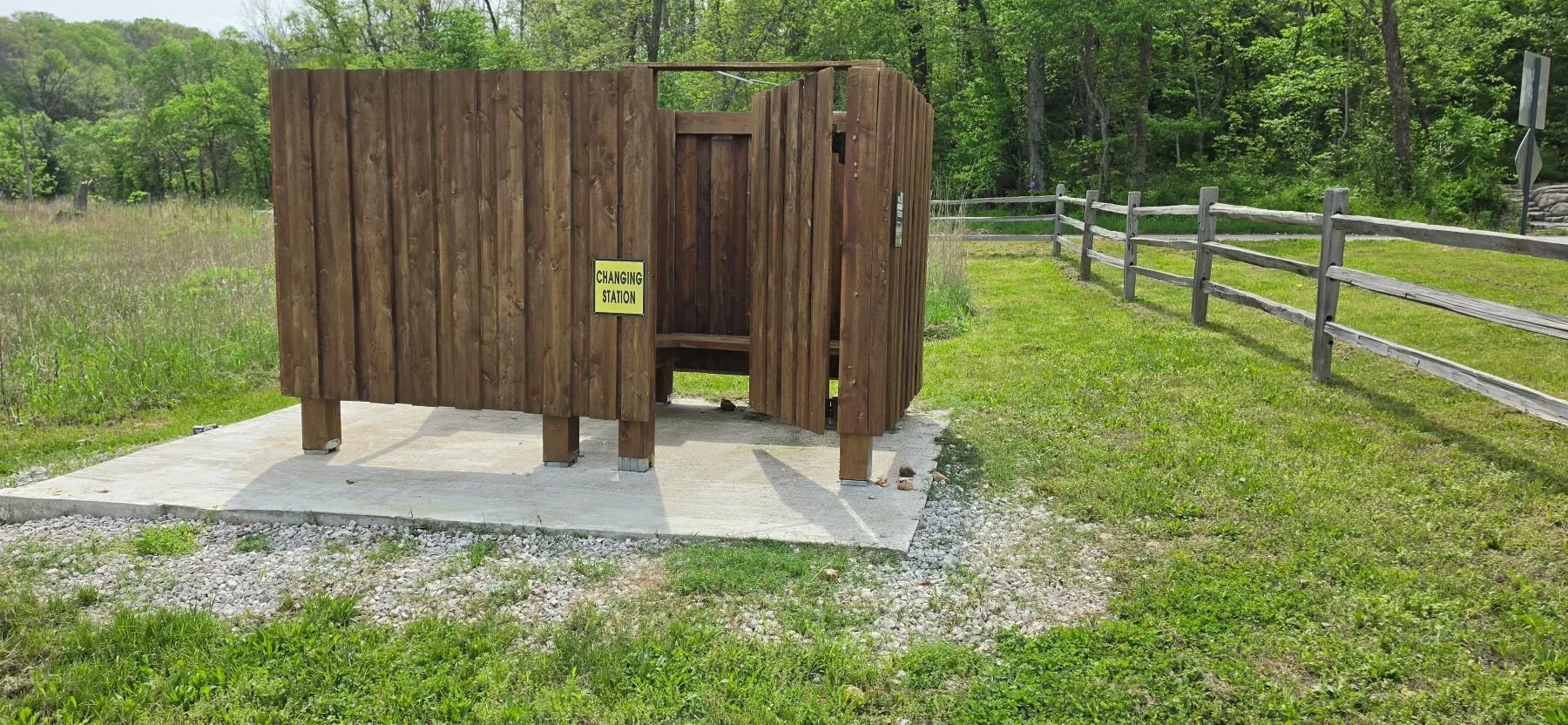 A picture of the changing station found along side the parking lot at Price Coffee Road Parking Lot