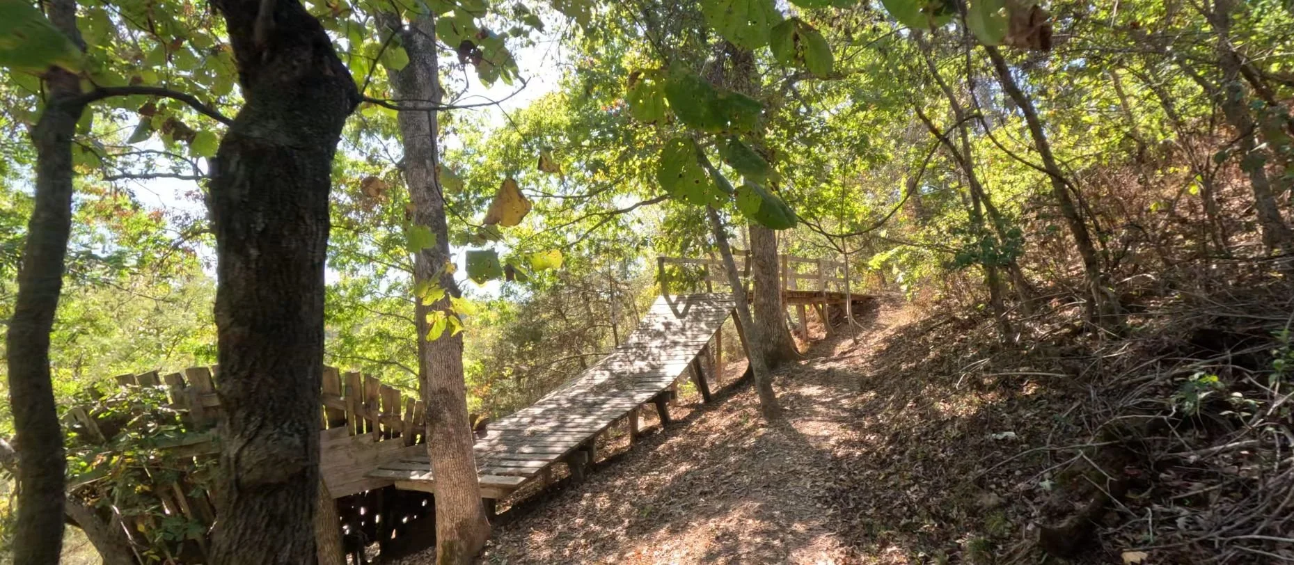 A side profile picture of the Boneyard Ramp an iconic corkscrew style ramp that is part of Skid Marks and the Boneyard Trails