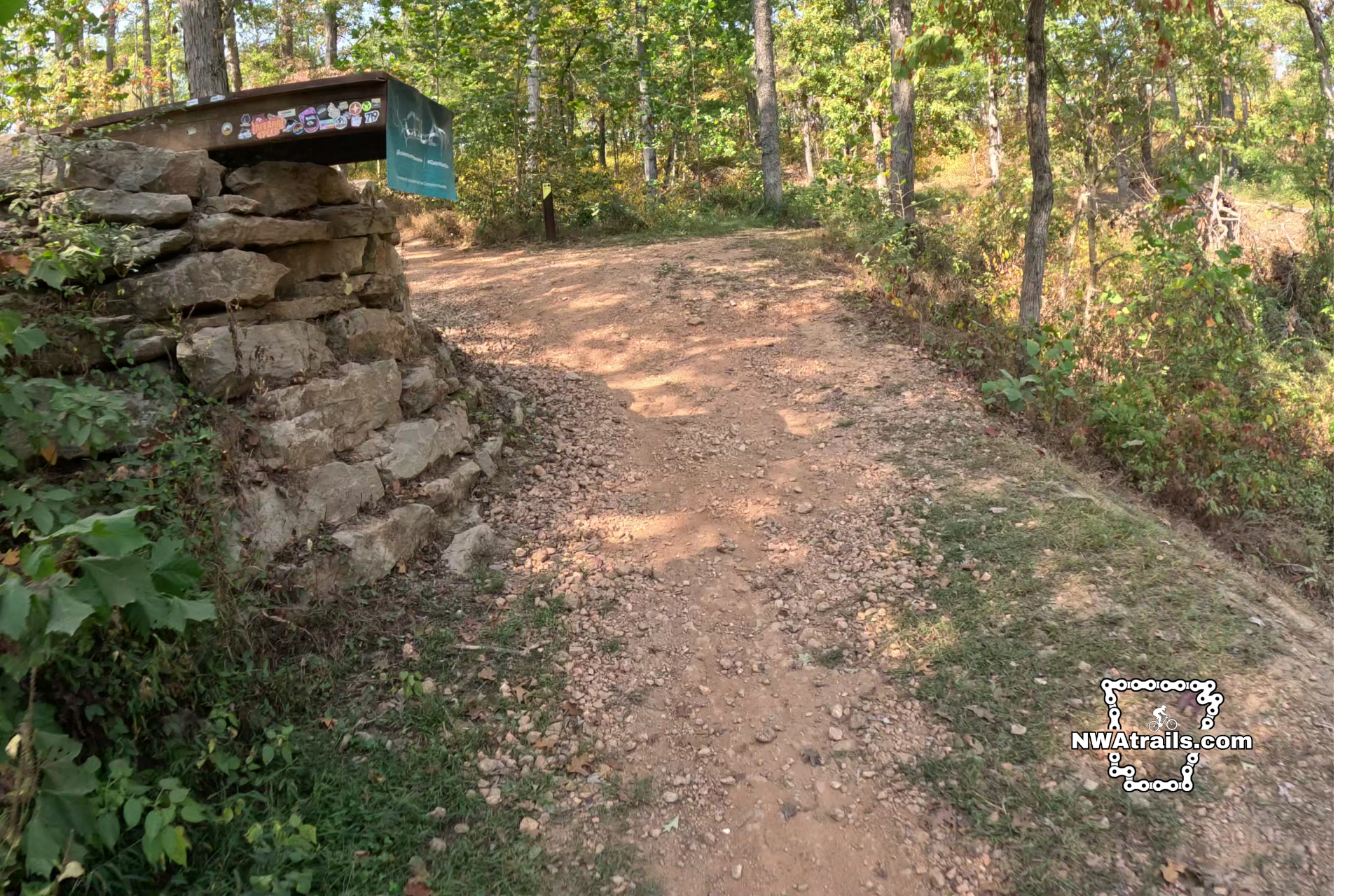 A side view of the black diamond trail Drop the Hammer's ramp. Riders that go off the end of this ramp descend 12 feet over a wide pathway and into a ravine.